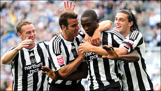 Happier times as Taylor and Carroll congratulate Shola Ameobi