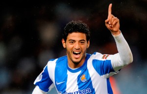 Carlos Vela has insisted he is happy at Real Sociedad amid ongoing speculation linking him with a sensational return to the Emirates Stadium.