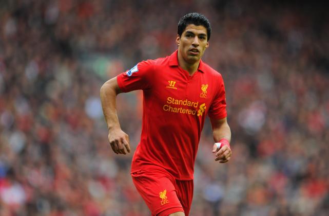 Luis Suarez has revealed he is happy at Liverpool amid speculation linking him with a summer move away from Anfield.