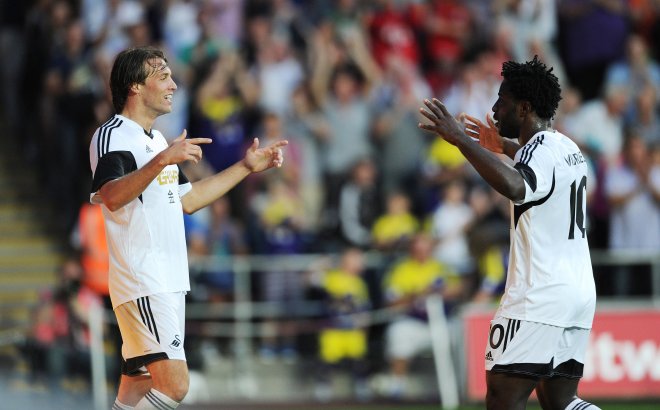 Swansea City A.F.C. striker Wilfried Bony has urged Michu to stay at the Liberty Stadium amid reported interest from Arsenal.