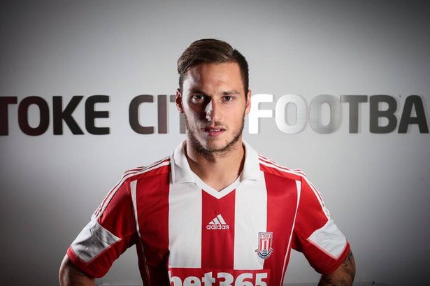 Stoke City F.C. forward Marko Arnautovic has insisted he is happy at the club amid reports claiming he could leave the Britannia Stadium in the summer.